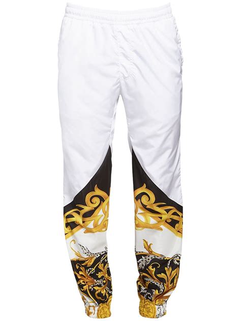 versace white denim pants|Versace track pants.